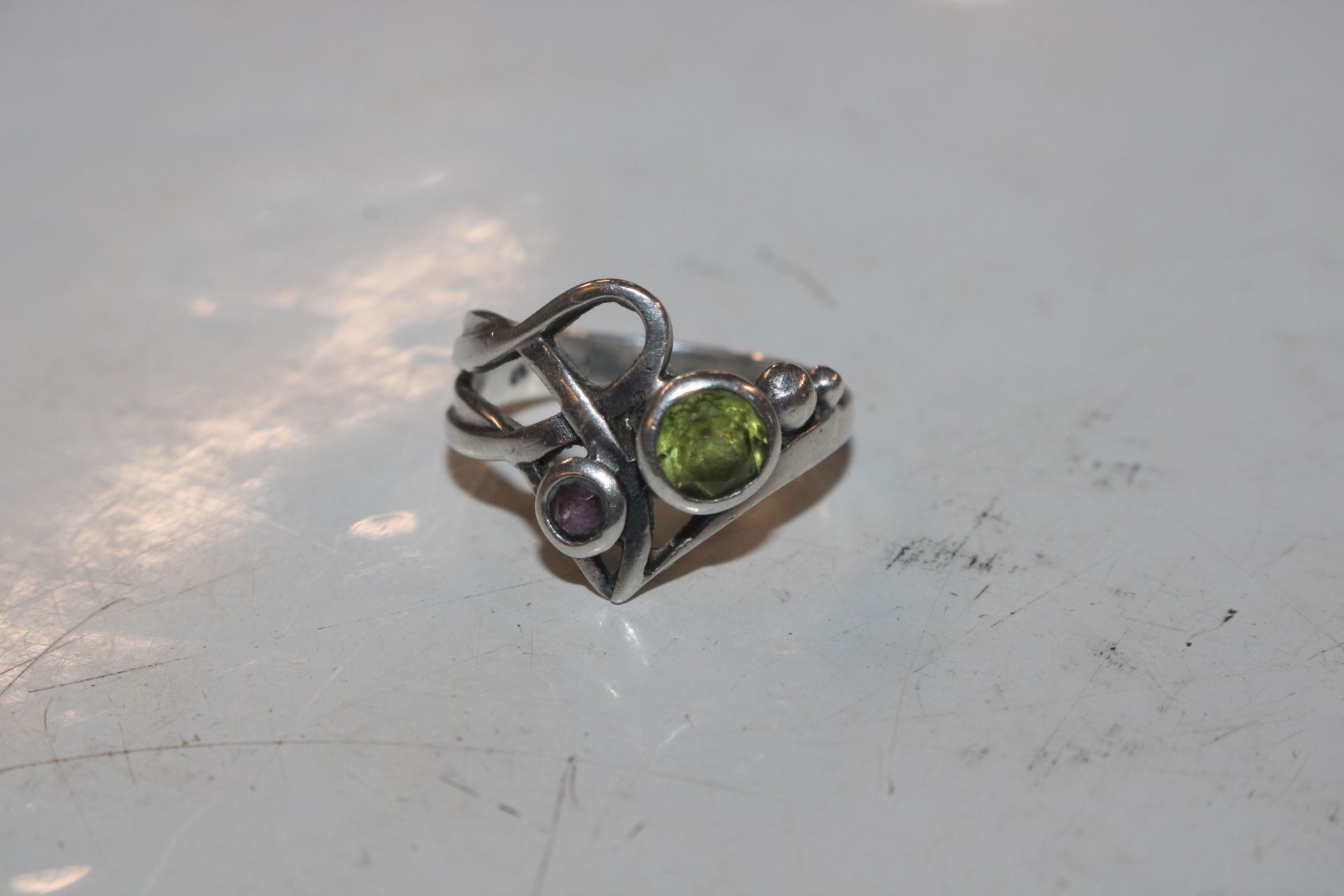 A 925 marked silver ring set with green and purple - Image 2 of 4