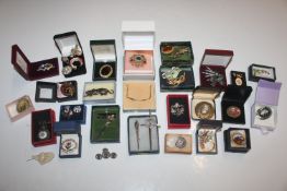 A box containing micro mosaic brooches and various