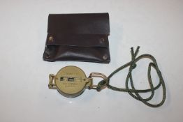 An engineer directional compass and pouch