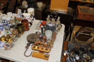 A pipe rack decorated with ships wheel; various st