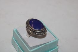A large Sterling silver and Lapis Lazuli set ring,