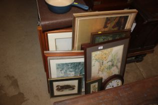 A quantity of various pictures and prints and a wall cl