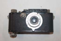 A Leica Ernst Leitz Wetzla D.R.P. camera with Leica leather case AF
