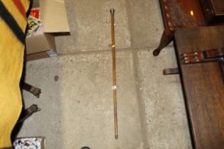 A silver capped walking stick