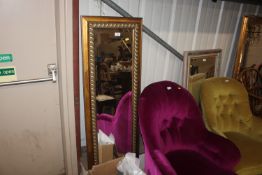 A gilt framed bevel edged oblong wall mirror