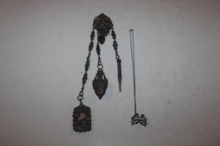 A white metal chatelaine
