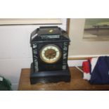 A Victorian slate mantel clock with eight day move