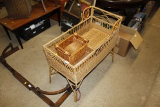 A wicker cot and wicker baskets