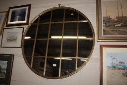 A large circular wall mirror