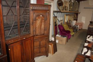 An Ipswich oak style corner cabinet