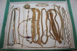 A box of gold tone jewellery, mainly necklaces