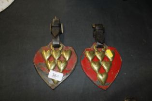 A pair of antique horse brasses