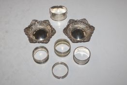 A box containing a pair of pierced silver dishes;