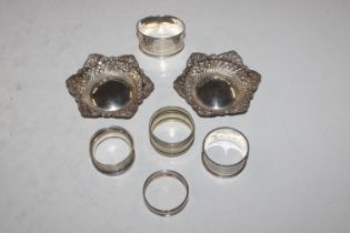 A box containing a pair of pierced silver dishes;