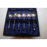 A set of six silver coffee bean spoons