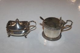 Two silver mustard pots and one silver spoon, tota