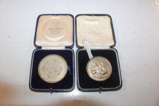 Two silver medallions for East and West Suffolk Co