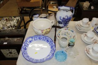 A wig stand and various blue and white china and g