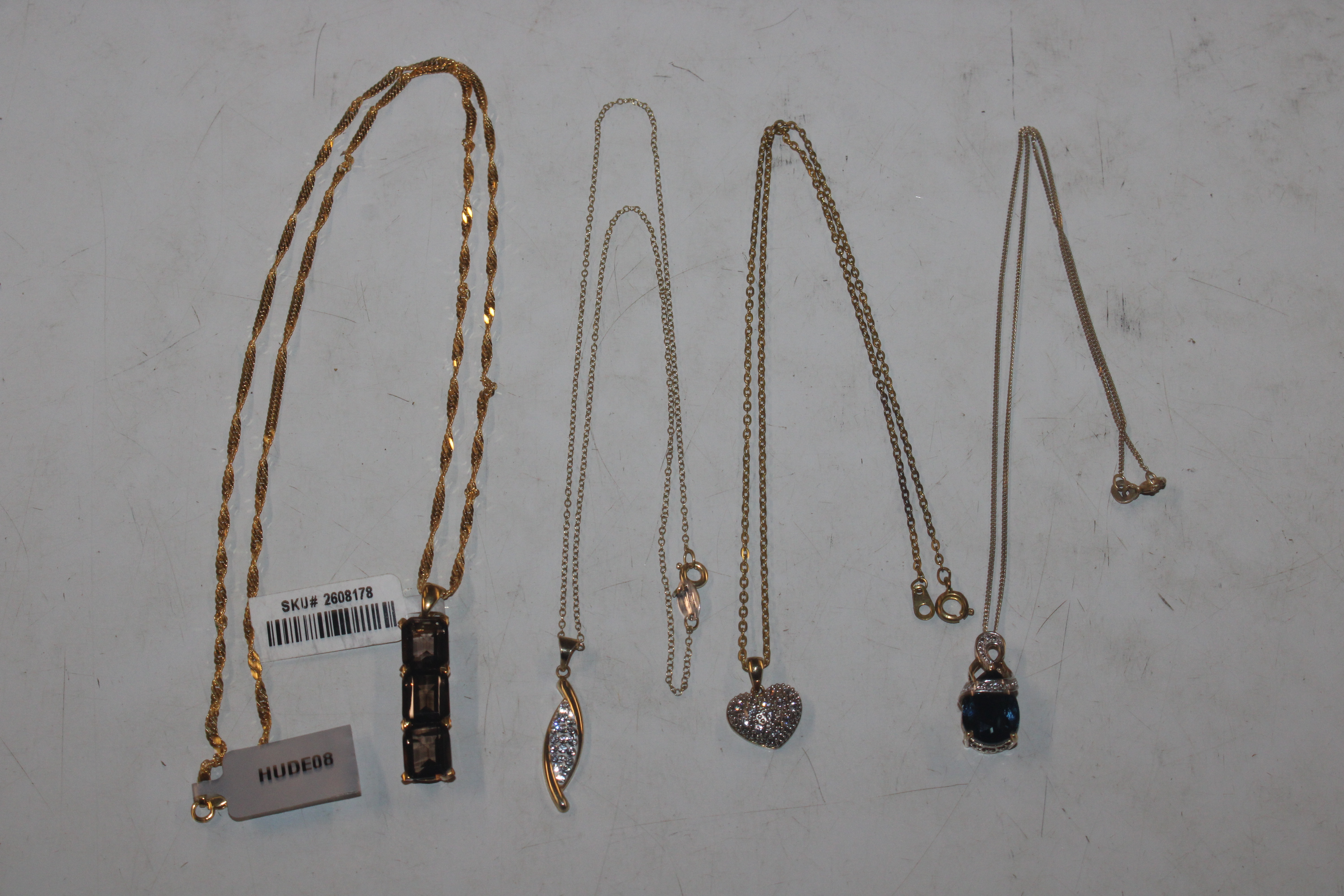 A 925 silver gilt necklace; a 925 silver and 9ct gold bonded necklace and two others