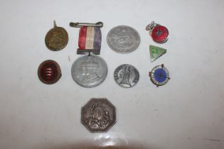 A box of various badges and medallions