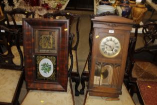 An oak cased wall clock with eight day movement an