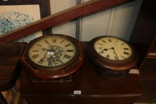 A single hole circular cased wall clock and one ot