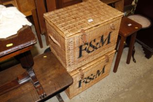 A pair of Fortnum & Masons wicker baskets