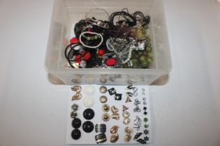 A box of costume jewellery to include ear-rings