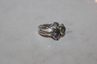 A 925 marked silver ring set with green and purple