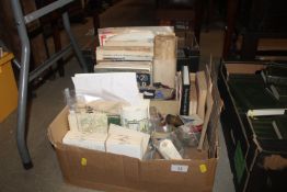 A box containing various mixed military items and