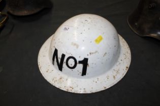 A WWII white Home Front helmet