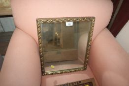 A gilt framed oblong wall mirror