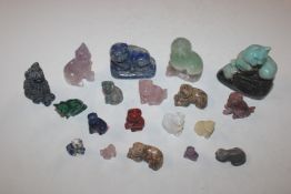 A plastic crate of various semi-precious stones an