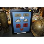 A WWII framed collection of RAF cloth badges