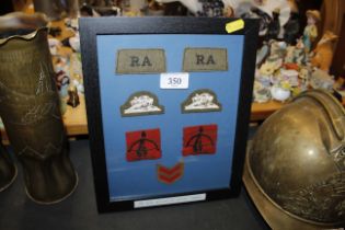 A WWII framed collection of RAF cloth badges