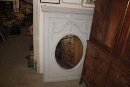 A decorative grey painted wall mirror