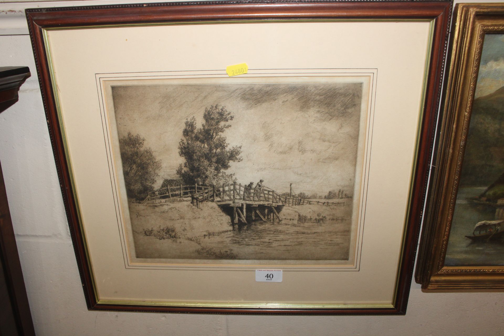 A framed and glazed engraving depicting figures fi