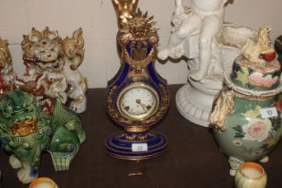 A Franklin Mint mantel clock with key