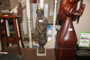A Spelter figure of a girl