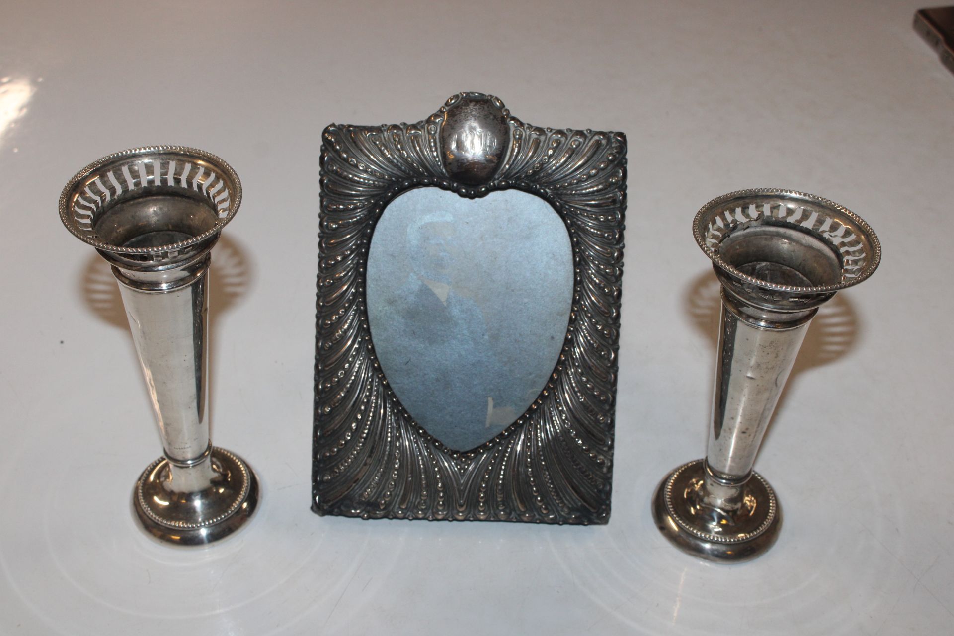 A silver easel photo frame AF; and a pair of silve