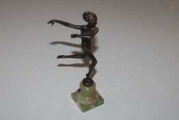 A bronze Art Deco style figure raised on onyx base