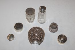 A quantity of silver topped jars and silver pill b