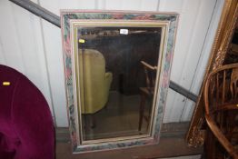 A floral decorated oblong bevel edged mirror