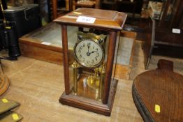 A mahogany cased anniversary clock