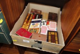 A box of assorted vintage card games including Lex