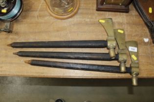 Three decorative brass and wooden tomahawks