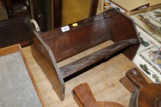 A 1930s oak book rack