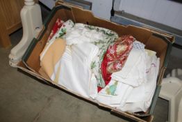 A box of various table napery and textiles