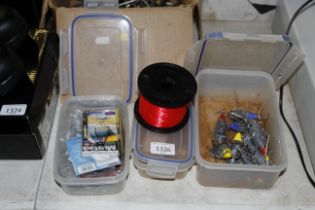 Three tubs of sea fishing tackle to include hooks,