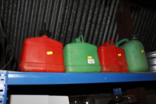 Four plastic fuel cans